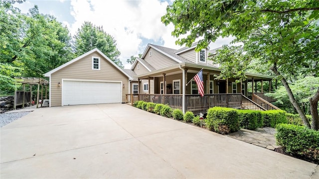 19641 Conestoga Rd, Elkins, AR 72727 - view of front of house featuring a porch and a garage