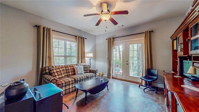 19641 Conestoga Rd, Elkins, AR 72727 - living room featuring french doors, finished concrete floors, and a ceiling fan