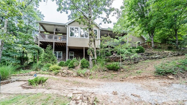 19641 Conestoga Rd, Elkins, AR 72727 - back of property featuring ceiling fan and a balcony