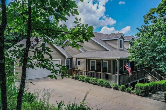 19641 Conestoga Rd, Elkins, AR 72727 - view of front of home featuring driveway, an attached garage, and roof with shingles
