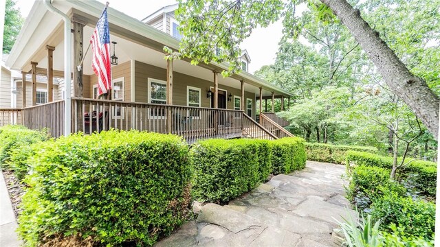 19641 Conestoga Rd, Elkins, AR 72727 - view of property exterior featuring a porch
