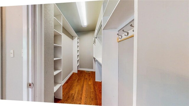 19641 Conestoga Rd, Elkins, AR 72727 - spacious closet with dark wood finished floors