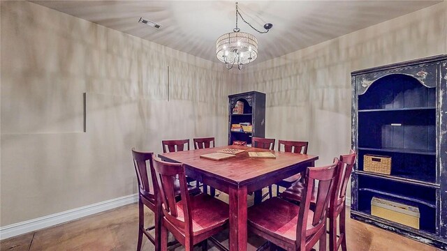 19641 Conestoga Rd, Elkins, AR 72727 - dining room with concrete flooring and a chandelier
