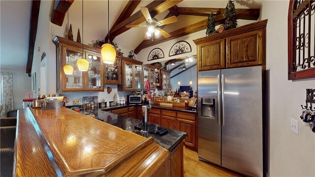 8271 S Lakeshore Dr, Rogers, AR 72756 - kitchen with stainless steel fridge with ice dispenser, a peninsula, a ceiling fan, dark countertops, and glass insert cabinets