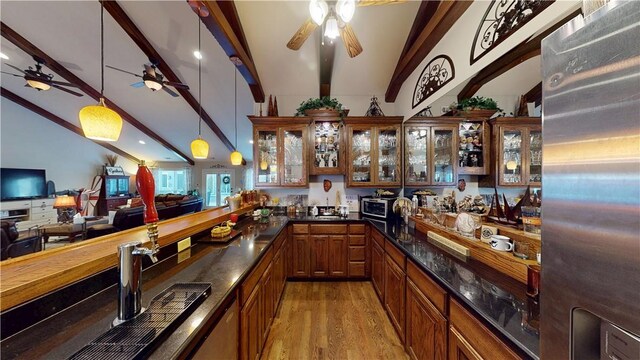 8271 S Lakeshore Dr, Rogers, AR 72756 - indoor wet bar featuring stainless steel refrigerator, ceiling fan, light wood-style floors, and decorative light fixtures