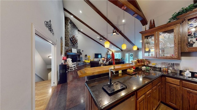 8271 S Lakeshore Dr, Rogers, AR 72756 - indoor wet bar with high vaulted ceiling, beamed ceiling, a fireplace, ceiling fan, and pendant lighting