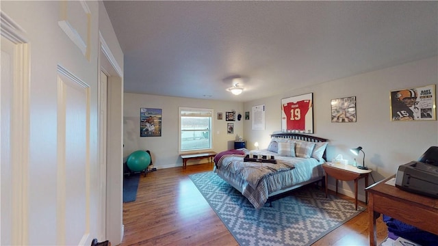 8271 S Lakeshore Dr, Rogers, AR 72756 - bedroom featuring wood finished floors and baseboards