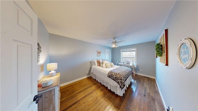 8271 S Lakeshore Dr, Rogers, AR 72756 - bedroom with wood finished floors and ceiling fan
