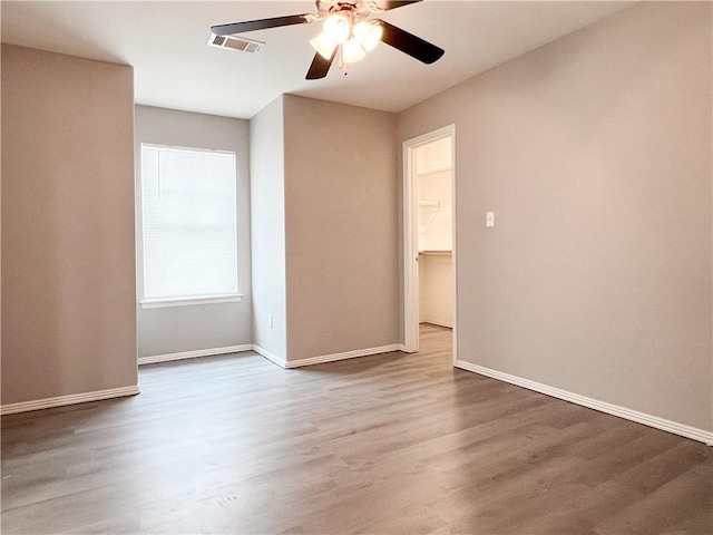 4066 W Sardinia Way, Fayetteville, AR 72704 - unfurnished room with ceiling fan and wood finished floors