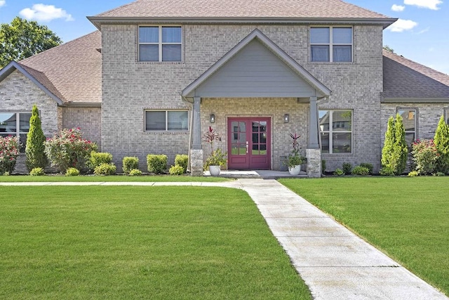 1575 Lake Estates Dr, Springdale, AR 72762 - craftsman house featuring french doors, a front lawn, a shingled roof, and brick siding