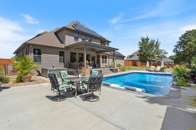 1575 Lake Estates Dr, Springdale, AR 72762 - view of swimming pool with a ceiling fan, a patio area, a fenced backyard, and outdoor dining space