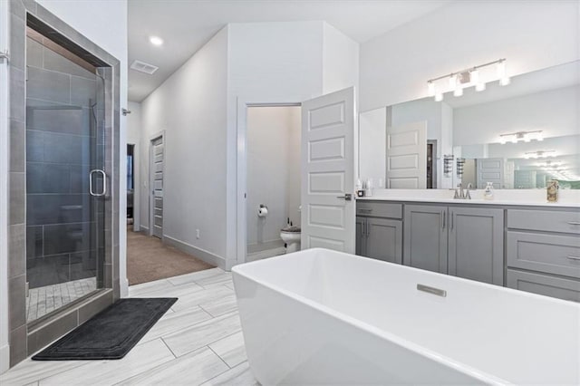 1575 Lake Estates Dr, Springdale, AR 72762 - full bathroom with a freestanding tub, a shower stall, vanity, and recessed lighting