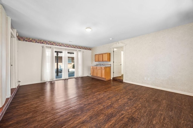2001 Pin Oak Dr, Springdale, AR 72762 - unfurnished living room featuring dark wood-type flooring