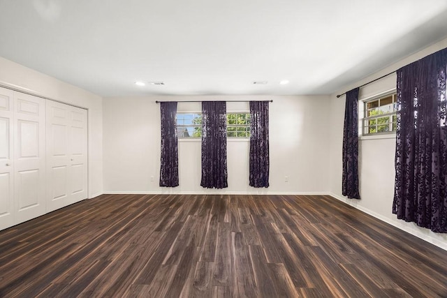 2001 Pin Oak Dr, Springdale, AR 72762 - unfurnished bedroom featuring wood finished floors, multiple windows, recessed lighting, and a closet