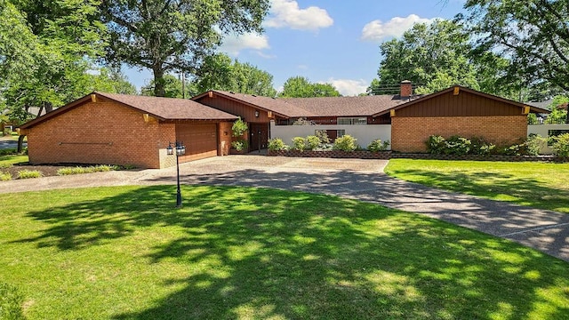 2001 Pin Oak Dr, Springdale, AR 72762 - view of front of property featuring brick siding, driveway, a front lawn, and a chimney