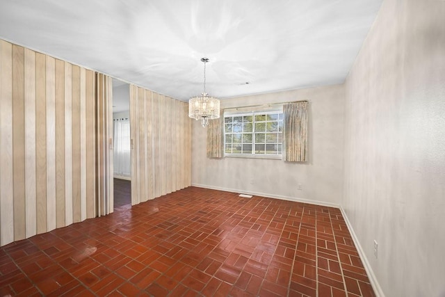 2001 Pin Oak Dr, Springdale, AR 72762 - empty room featuring brick patterned floors and a chandelier