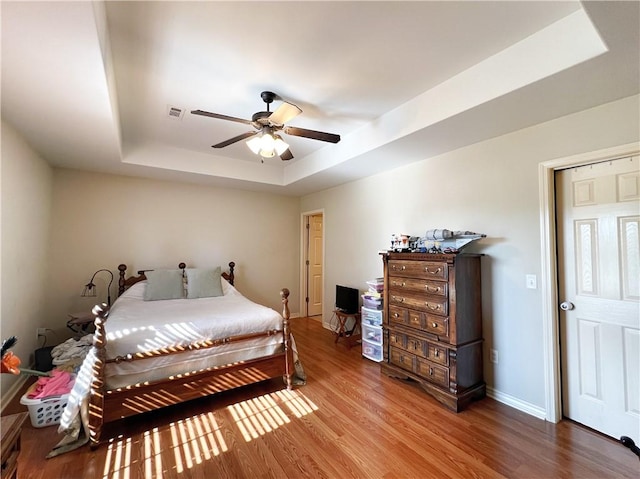 1459 Frisco Track Trce, Elkins, AR 72727 - bedroom with a raised ceiling, wood finished floors, and ceiling fan
