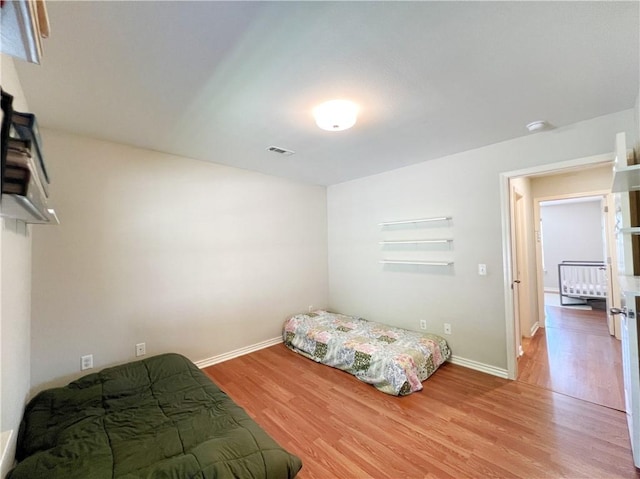 1459 Frisco Track Trce, Elkins, AR 72727 - bedroom featuring light wood-style floors and baseboards