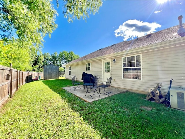 1459 Frisco Track Trce, Elkins, AR 72727 - fenced backyard featuring a storage shed and a patio