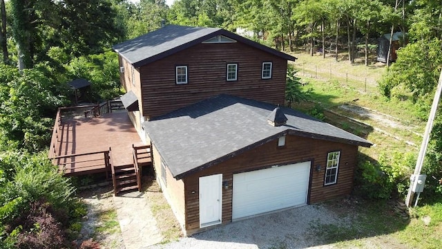 22198 E Ar 12th Hwy, Rogers, AR 72756 - view of side of property featuring a garage, a deck, and driveway