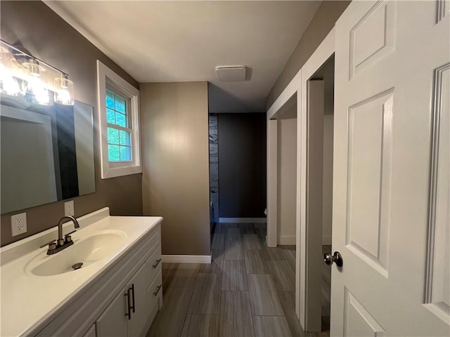 22198 E Ar 12th Hwy, Rogers, AR 72756 - bathroom with vanity and wood finished floors