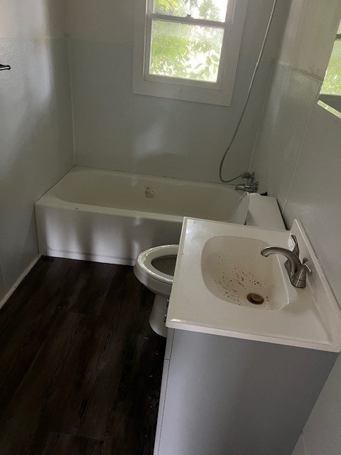 18588 W Rheas Community Rd, Lincoln, AR 72744 - full bathroom with plenty of natural light, vanity, wood finished floors, and washtub / shower combination
