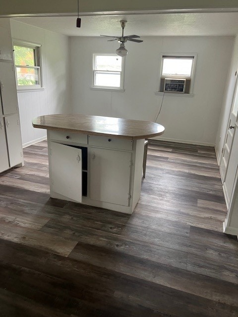 18588 W Rheas Community Rd, Lincoln, AR 72744 - kitchen with wooden counters, dark wood-style flooring, and a kitchen island