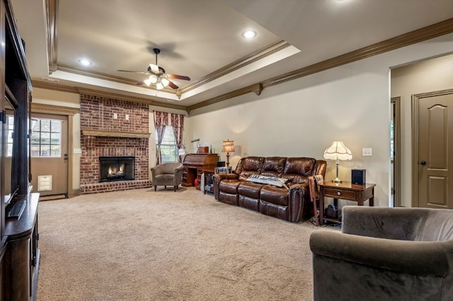3004 N 16th St, Rogers, AR 72756 - living area with crown molding, ceiling fan, carpet floors, a raised ceiling, and healthy amount of natural light