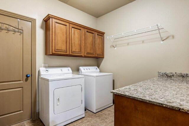 3004 N 16th St, Rogers, AR 72756 - washroom featuring cabinet space, washing machine and clothes dryer, and light tile patterned floors