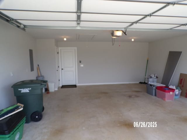 298 S Benchmark Ln, Fayetteville, AR 72704 - garage featuring a garage door opener and electric panel