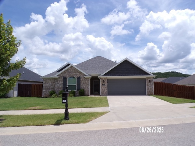 298 S Benchmark Ln, Fayetteville, AR 72704 - single story home with a garage, concrete driveway, brick siding, and a shingled roof