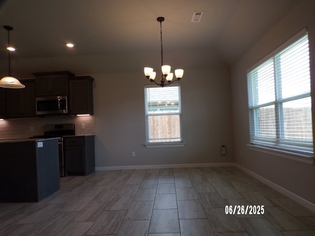 298 S Benchmark Ln, Fayetteville, AR 72704 - kitchen with appliances with stainless steel finishes, a chandelier, backsplash, recessed lighting, and pendant lighting
