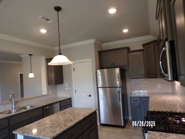 298 S Benchmark Ln, Fayetteville, AR 72704 - kitchen featuring appliances with stainless steel finishes, dark brown cabinetry, light stone countertops, backsplash, and hanging light fixtures