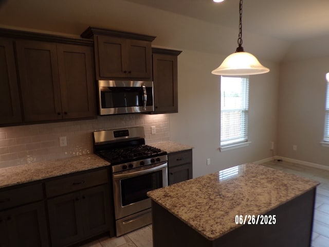 298 S Benchmark Ln, Fayetteville, AR 72704 - kitchen with appliances with stainless steel finishes, healthy amount of natural light, tasteful backsplash, a kitchen island, and lofted ceiling