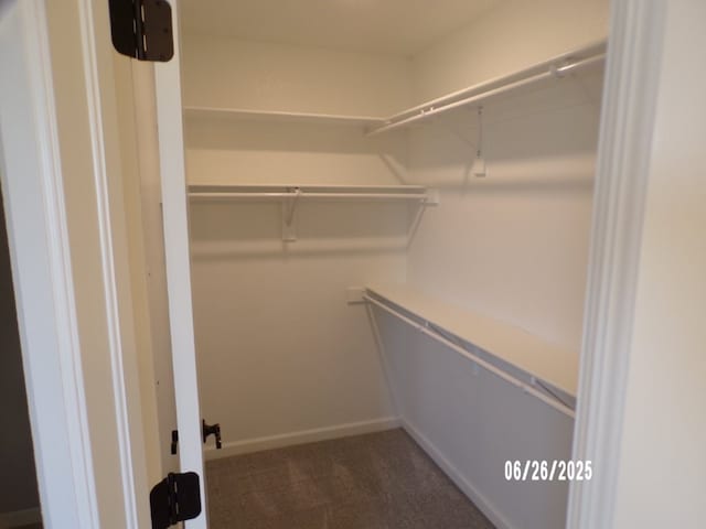 298 S Benchmark Ln, Fayetteville, AR 72704 - spacious closet featuring dark colored carpet
