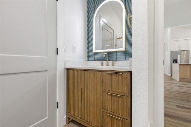 1348 Columbine Cv, Harrison, AR 72601 - bathroom with vanity and wood finished floors