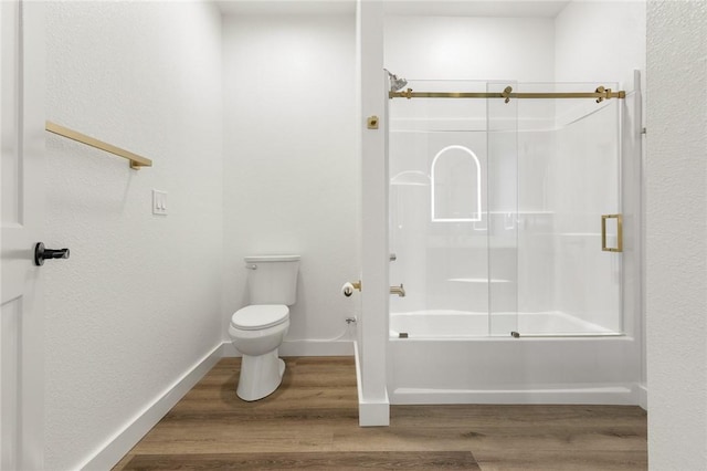 1348 Columbine Cv, Harrison, AR 72601 - bathroom featuring bath / shower combo with glass door and wood finished floors