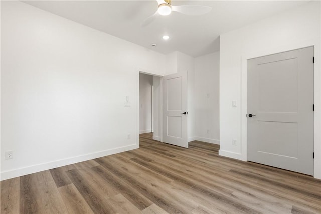 1348 Columbine Cv, Harrison, AR 72601 - unfurnished bedroom with wood finished floors, a ceiling fan, and recessed lighting