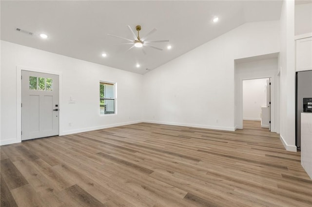 1348 Columbine Cv, Harrison, AR 72601 - unfurnished living room featuring a ceiling fan, lofted ceiling, light wood-style floors, and recessed lighting