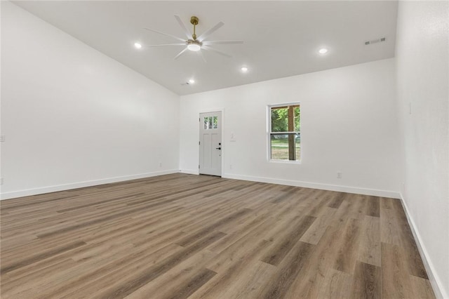 1348 Columbine Cv, Harrison, AR 72601 - empty room featuring a ceiling fan, lofted ceiling, wood finished floors, and recessed lighting