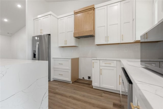 1348 Columbine Cv, Harrison, AR 72601 - kitchen featuring appliances with stainless steel finishes, light wood-style floors, light stone countertops, recessed lighting, and white cabinets