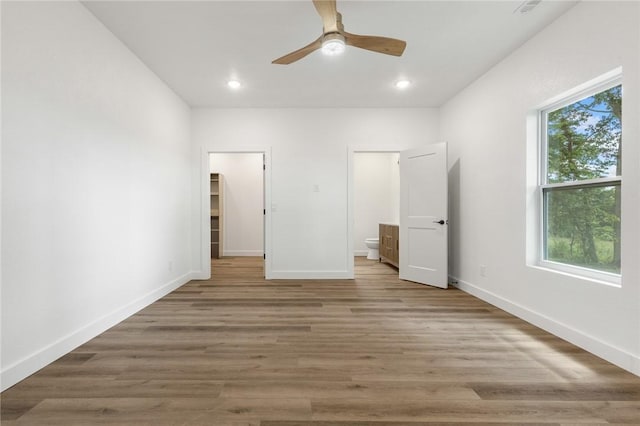 1348 Columbine Cv, Harrison, AR 72601 - unfurnished bedroom with wood finished floors, recessed lighting, ceiling fan, and ensuite bathroom