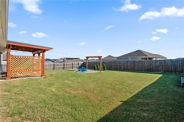 2504 Maplewood Ave, Lowell, AR 72745 - fenced backyard with a patio area
