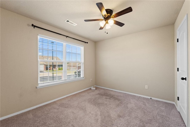 2504 Maplewood Ave, Lowell, AR 72745 - carpeted spare room featuring ceiling fan and baseboards