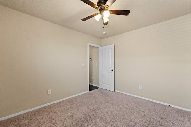 2504 Maplewood Ave, Lowell, AR 72745 - carpeted empty room featuring ceiling fan and a smoke detector