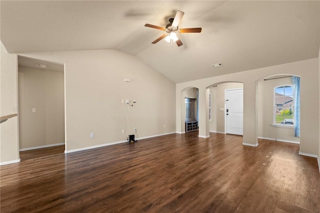 2504 Maplewood Ave, Lowell, AR 72745 - unfurnished living room featuring ceiling fan, lofted ceiling, arched walkways, and dark wood-style floors