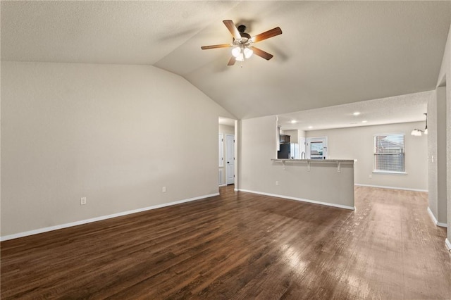 2504 Maplewood Ave, Lowell, AR 72745 - unfurnished living room featuring ceiling fan, lofted ceiling, and dark wood finished floors