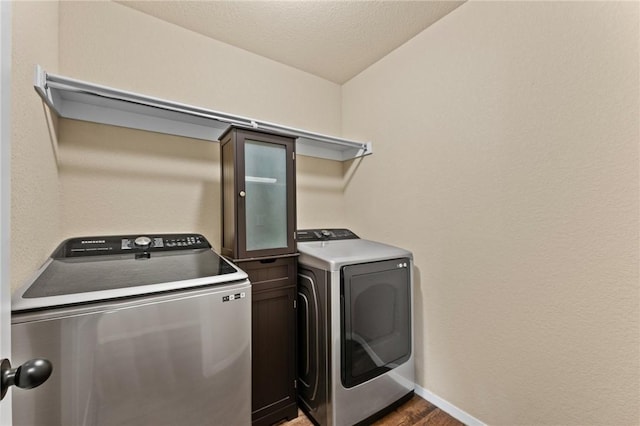 2504 Maplewood Ave, Lowell, AR 72745 - laundry room with washing machine and dryer and wood finished floors