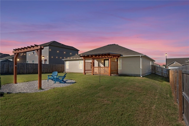 2504 Maplewood Ave, Lowell, AR 72745 - back of property at dusk with a pergola, a fenced backyard, a patio area, and a shingled roof