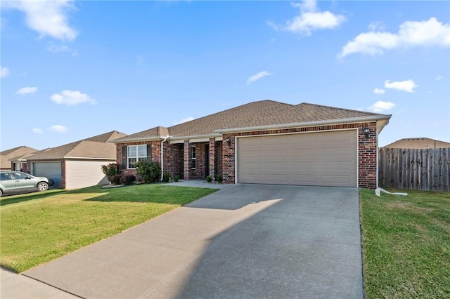2504 Maplewood Ave, Lowell, AR 72745 - ranch-style house with brick siding, concrete driveway, a garage, and a shingled roof